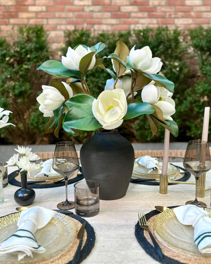 Magnolias in Black Terracotta Vase